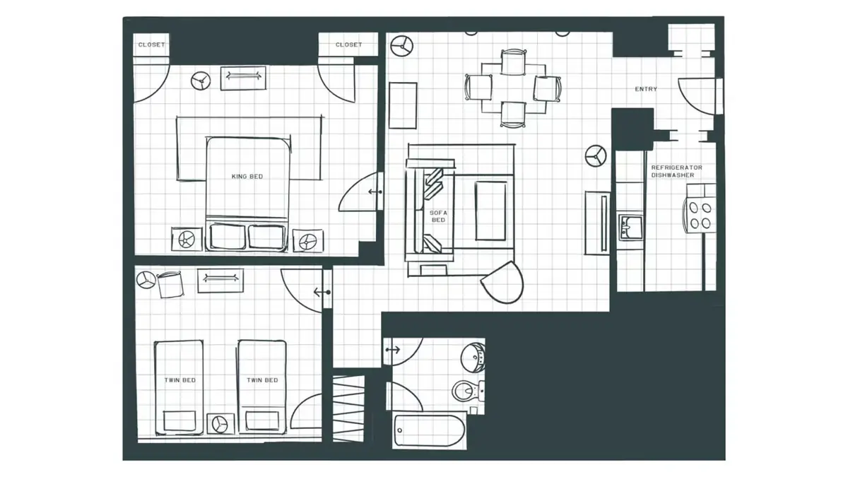 Floor plan of the two-bedroom apartment showing a living and dining area, kitchen, and two bedrooms with bathrooms.