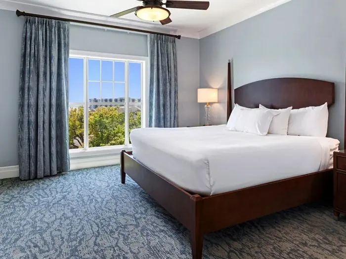 Bedroom with king bed and window.